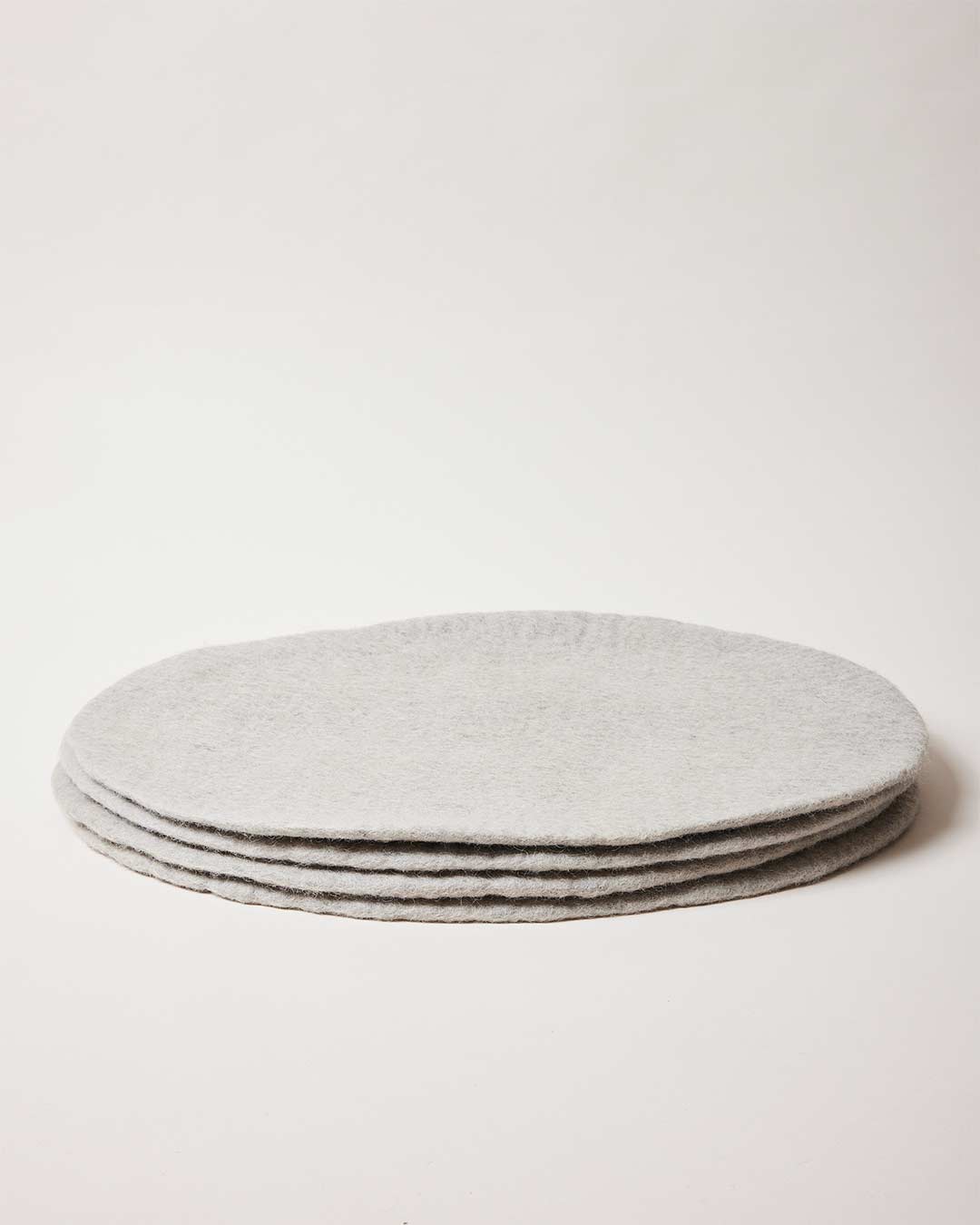 Farmhouse Pottery artisan felt placemats in stone set of 4.